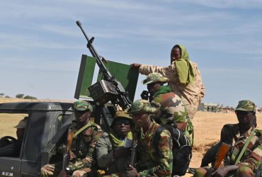 Nigerien soldiers patrol outside the Diffa airport in South-East Niger, near the Nigerian border, on December 23, 2020. - Under the constant threat of the Islamists of Boko Haram and its dissidents, Diffa, the large city in southeastern Niger on the border with Nigeria, lives under siege with frightened and economically strapped inhabitants. (Photo by Issouf SANOGO / AFP)